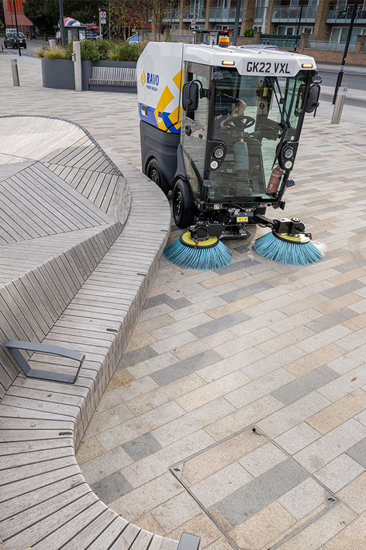 RAVO R1 sweeping around street furniture in Battersea, London.