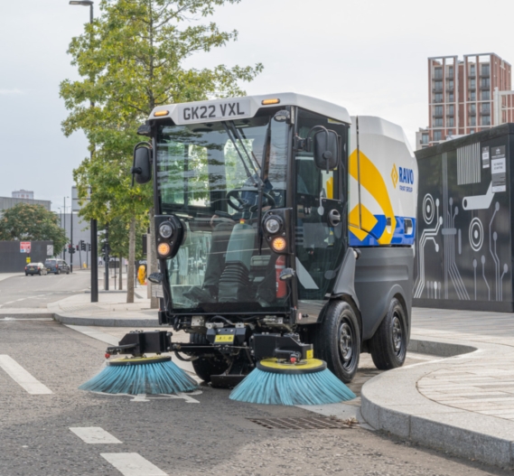 RAVO R1 sweeper cleaning in a playground.