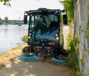 E2 sweeping a cycle path along the river.